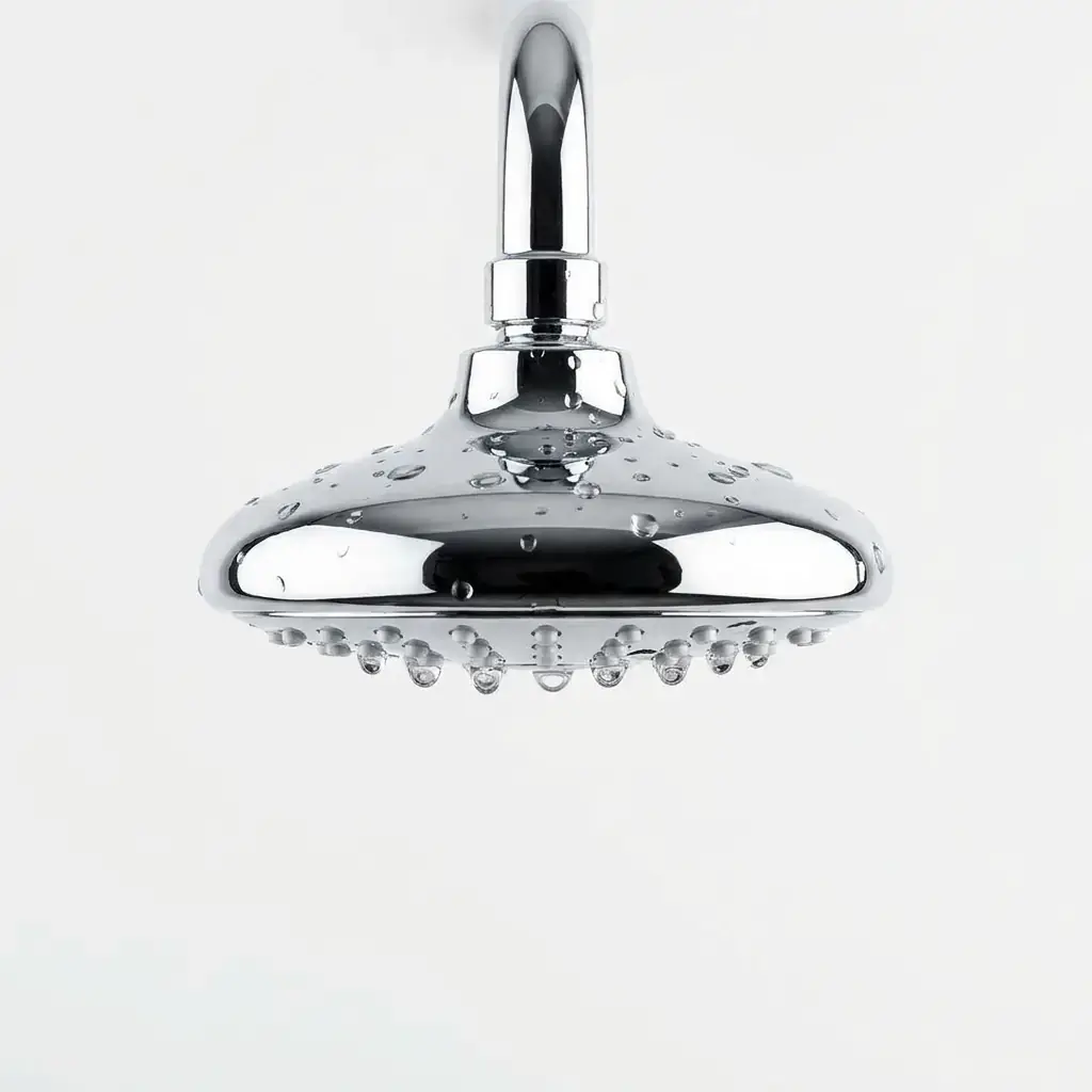 Chrome shower head with water beaded across its face